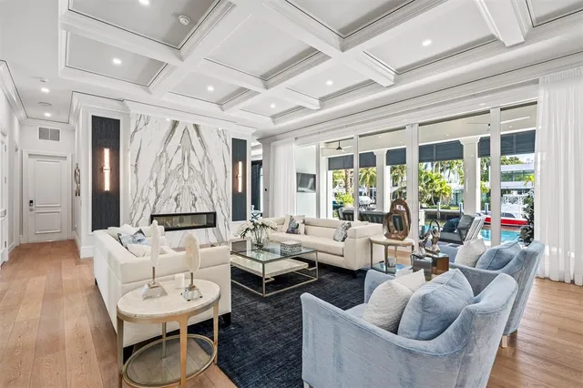 a living room with fireplace furniture and a wooden floor
