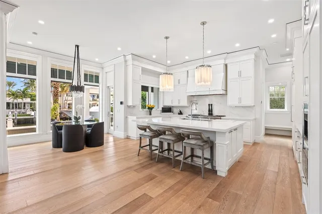 a kitchen with stainless steel appliances granite countertop a stove and refrigerator