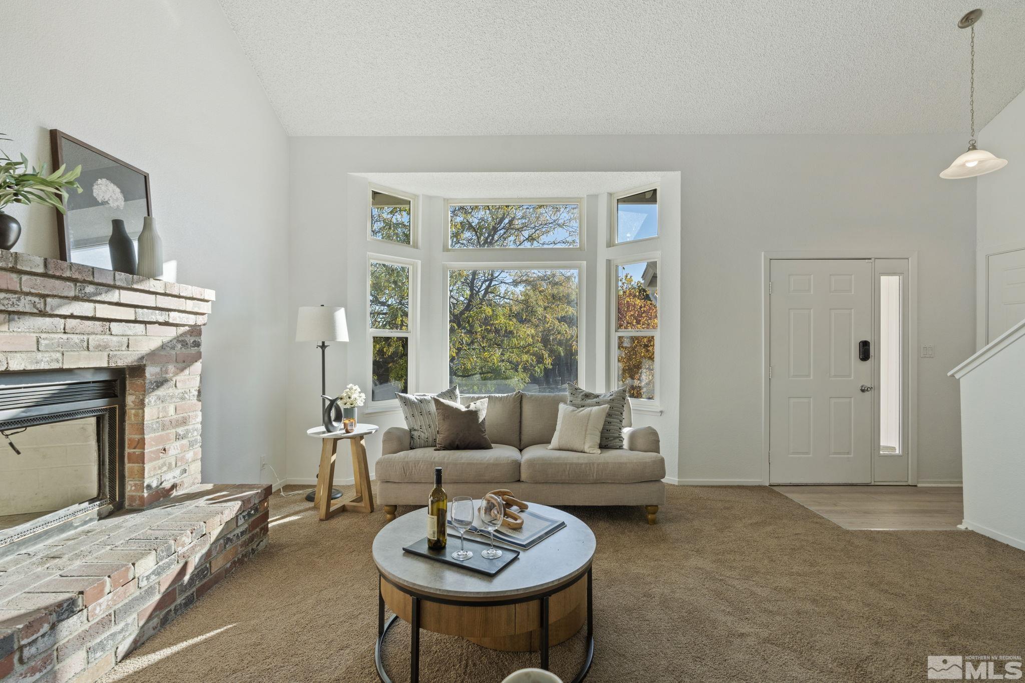 1960 Peavine Road Reno, NV 89503 - Photo 3 of 32 a living room with furniture a fireplace and a table