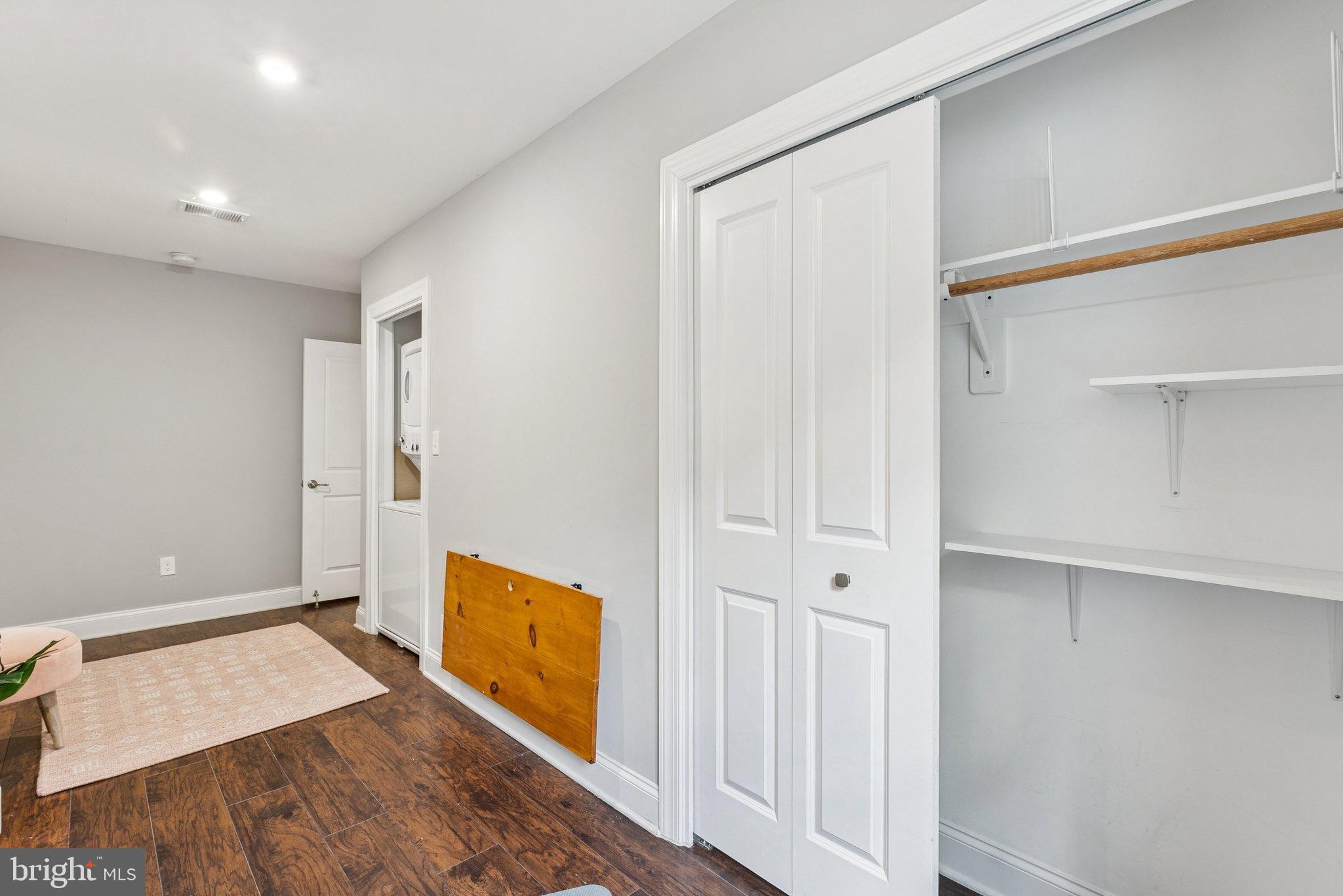 718 Jackson Street Northeast, Unit 1 Washington, DC 20017 - Photo 11 of 24 a view of a big room with wooden floor and windows