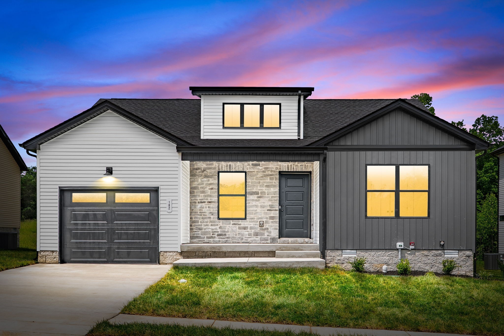 a front view of a house with a yard