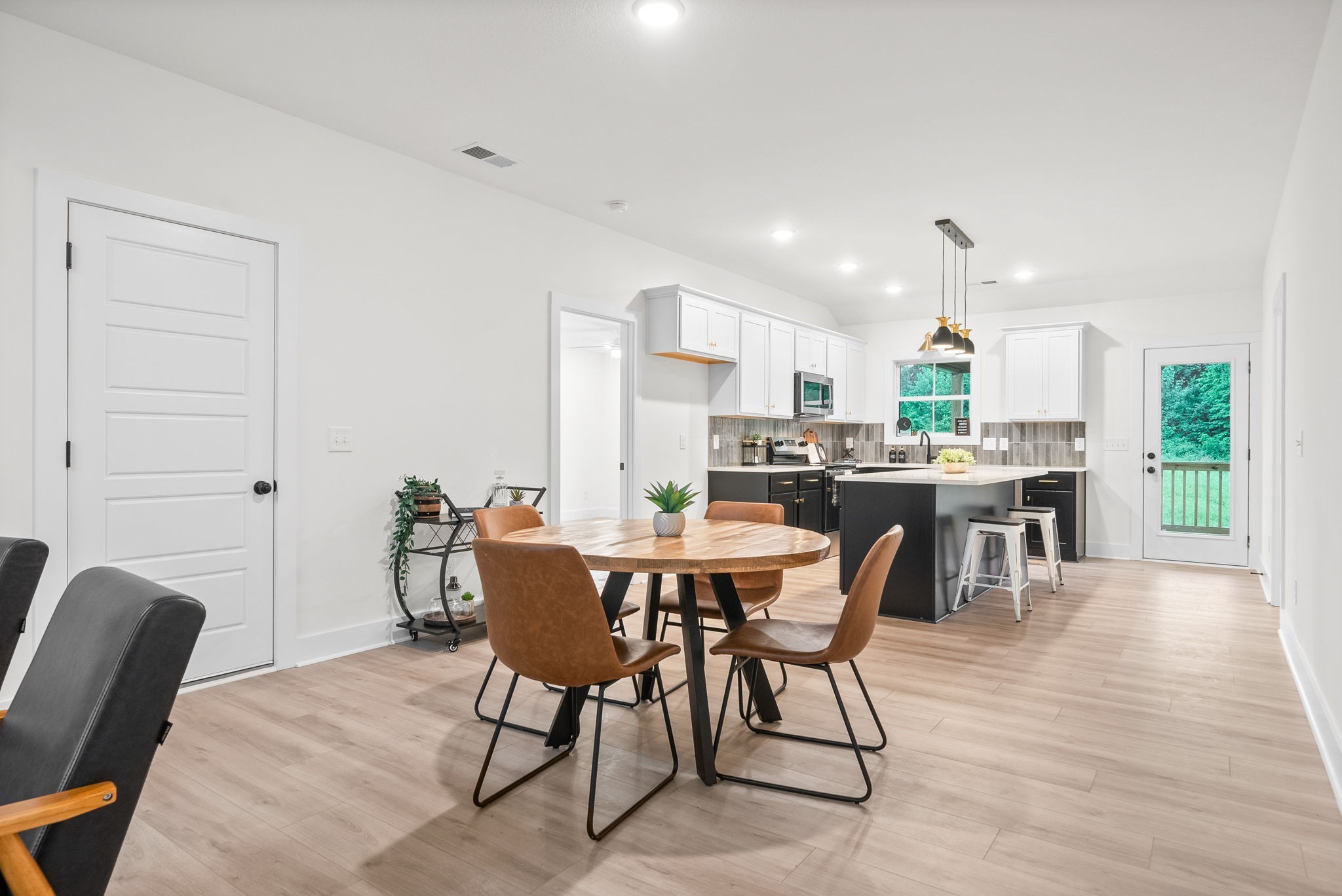 201 Dewberry Road Clarksville, TN 37042 - Photo 12 of 56 a view of a dining room with furniture and wooden floor