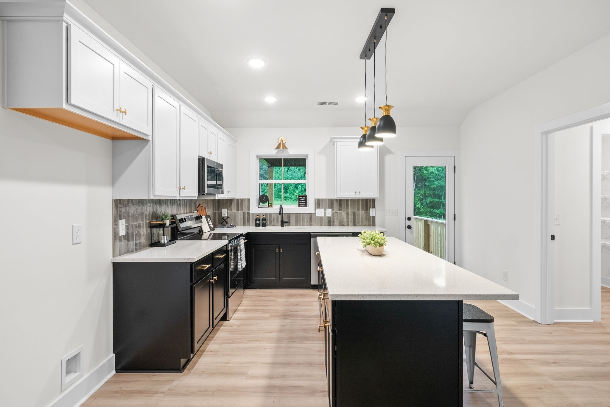 201 Dewberry Road Clarksville, TN 37042 - Photo 15 of 56 a kitchen with kitchen island a sink a counter top space and appliances