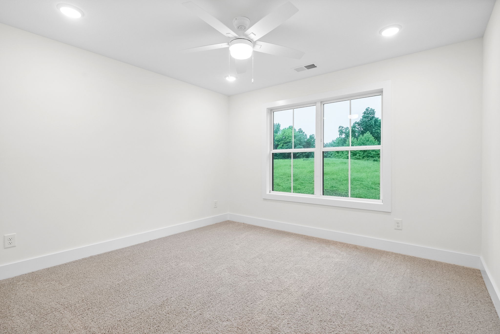201 Dewberry Road Clarksville, TN 37042 - Photo 20 of 56 an empty room with a window and a ceiling fan