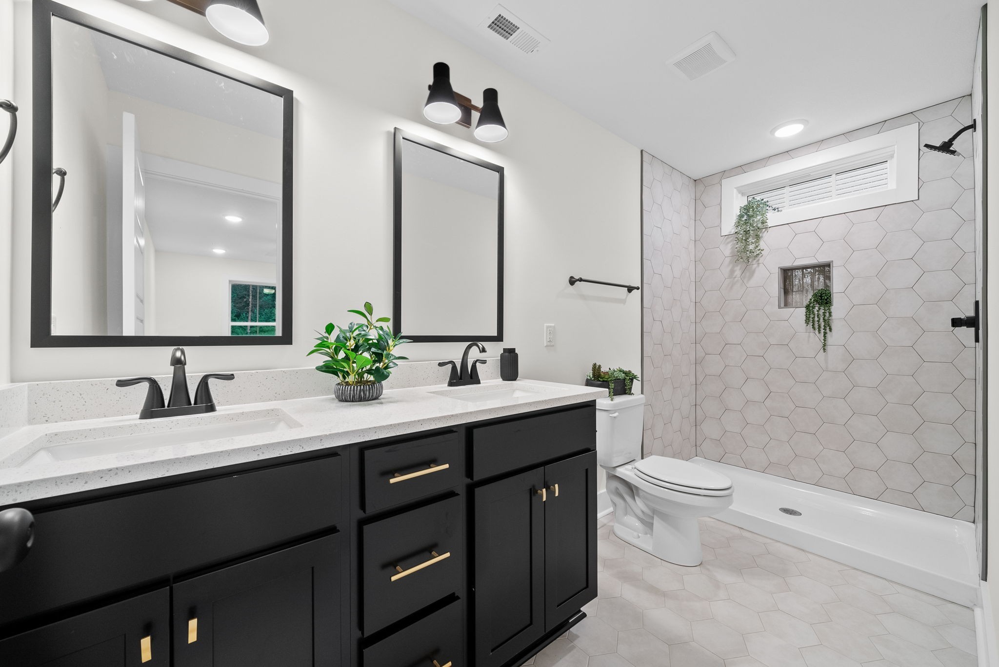 201 Dewberry Road Clarksville, TN 37042 - Photo 22 of 56 a bathroom with a double vanity sink toilet and shower