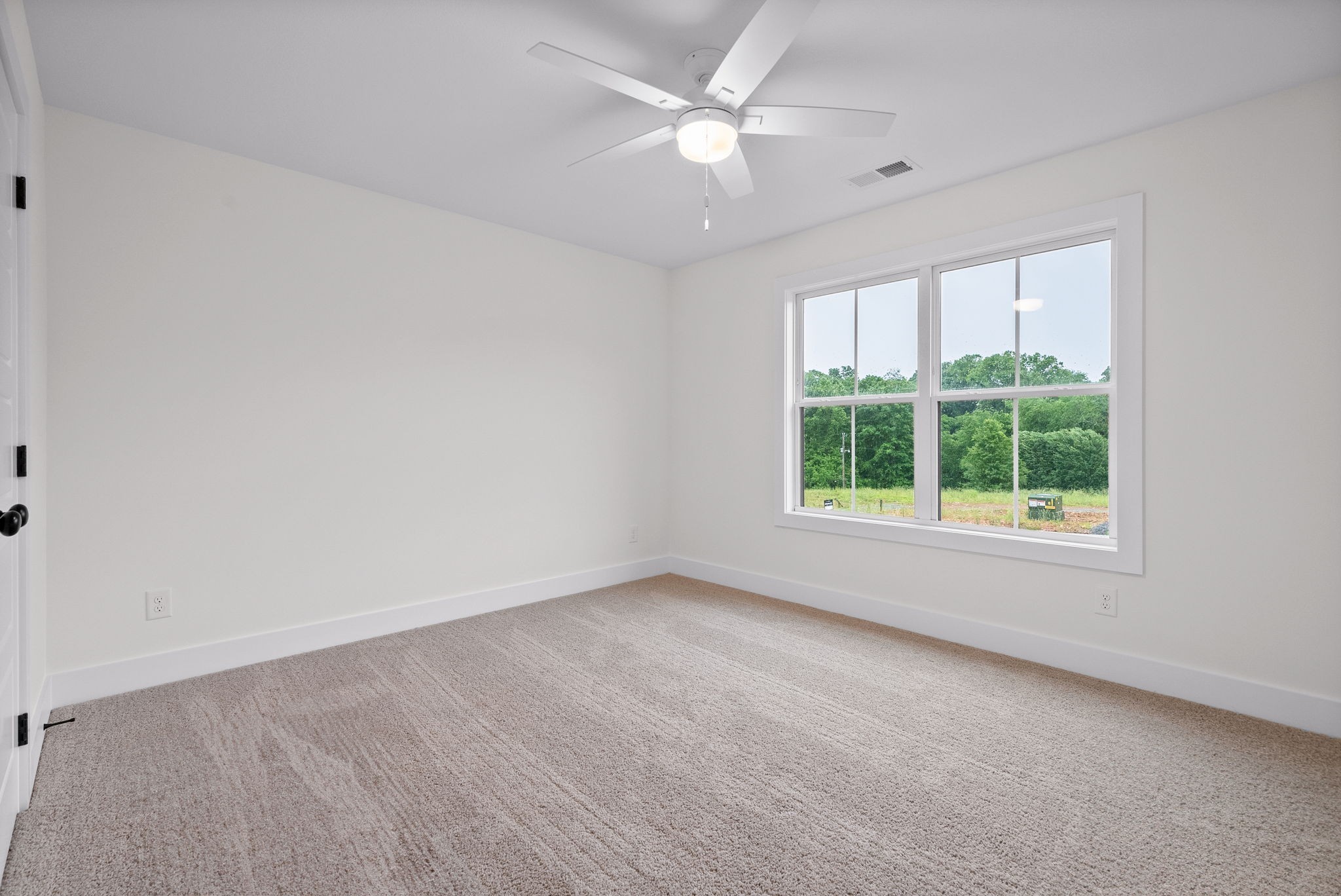 201 Dewberry Road Clarksville, TN 37042 - Photo 26 of 56 an empty room with a window and a ceiling fan