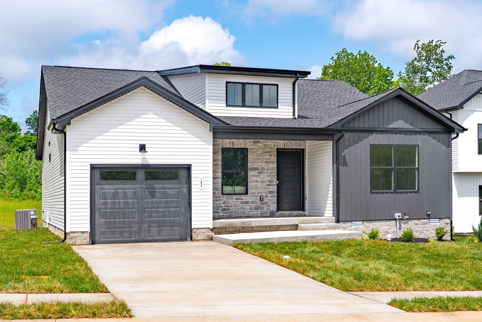 201 Dewberry Road Clarksville, TN 37042 - Photo 4 of 56 a front view of a house with a yard and garage