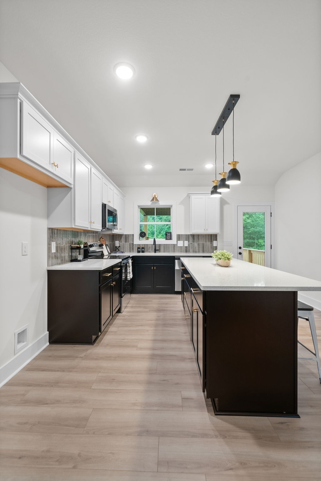 201 Dewberry Road Clarksville, TN 37042 - Photo 51 of 56 a kitchen with stainless steel appliances kitchen island sink wooden cabinets and granite counter tops