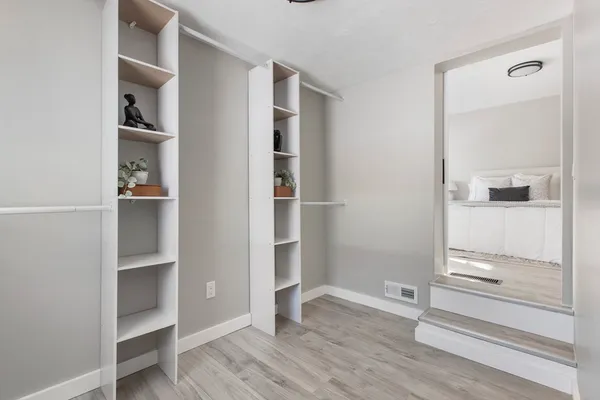 a view of an empty walk in closet