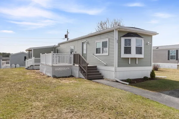 a view of a house with a yard