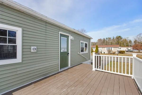 a view of a balcony with wooden floor