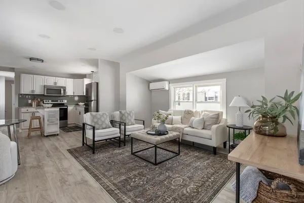 a living room with furniture and a table