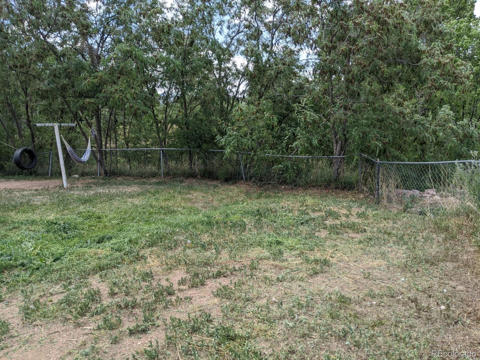 1720 Hampton South, Unit 3 Colorado Springs, CO 80906 - Photo 19 of 19 a view of a backyard