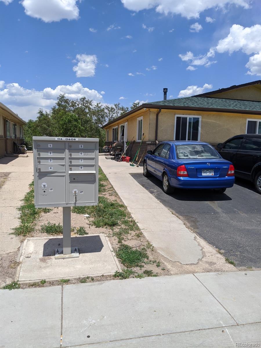 1720 Hampton South, Unit 3 Colorado Springs, CO 80906 - Photo 2 of 19 a front view of a house with garden