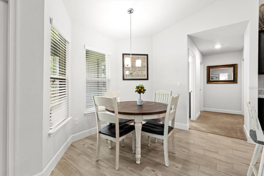 11042 Heth Court Weeki Wachee, FL 34613 - Photo 12 of 43 a view of a dining room with furniture and window