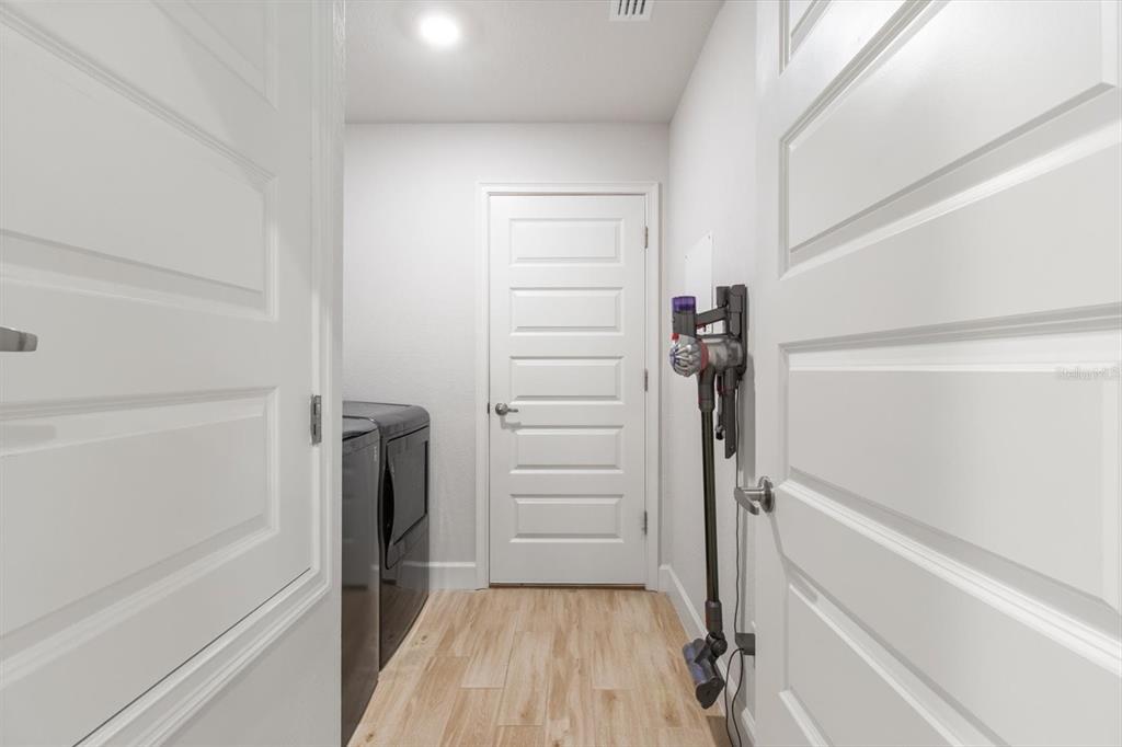 11042 Heth Court Weeki Wachee, FL 34613 - Photo 16 of 43 a view of walk in closet with empty racks