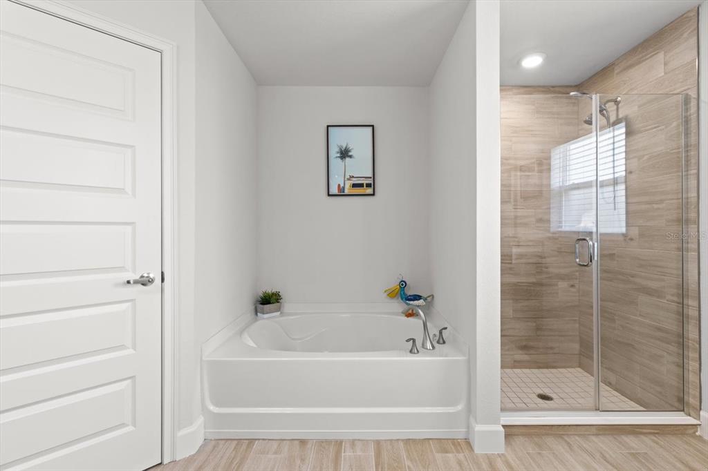 11042 Heth Court Weeki Wachee, FL 34613 - Photo 28 of 43 a bathroom with a bathtub and a shower