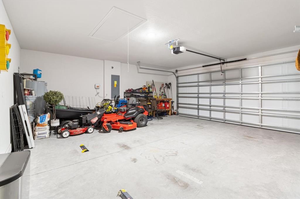 11042 Heth Court Weeki Wachee, FL 34613 - Photo 33 of 43 a view of a garage with rack and bicycle