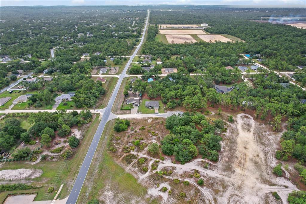 11042 Heth Court Weeki Wachee, FL 34613 - Photo 42 of 43 an aerial view of a house with a yard and lake view