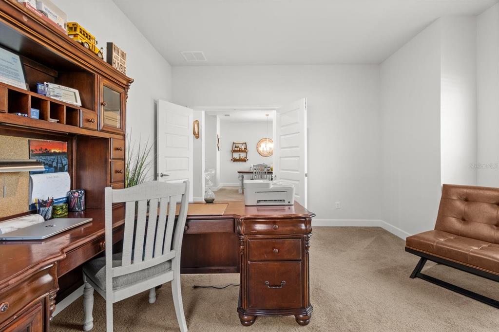 11042 Heth Court Weeki Wachee, FL 34613 - Photo 6 of 43 a dining room with furniture and window