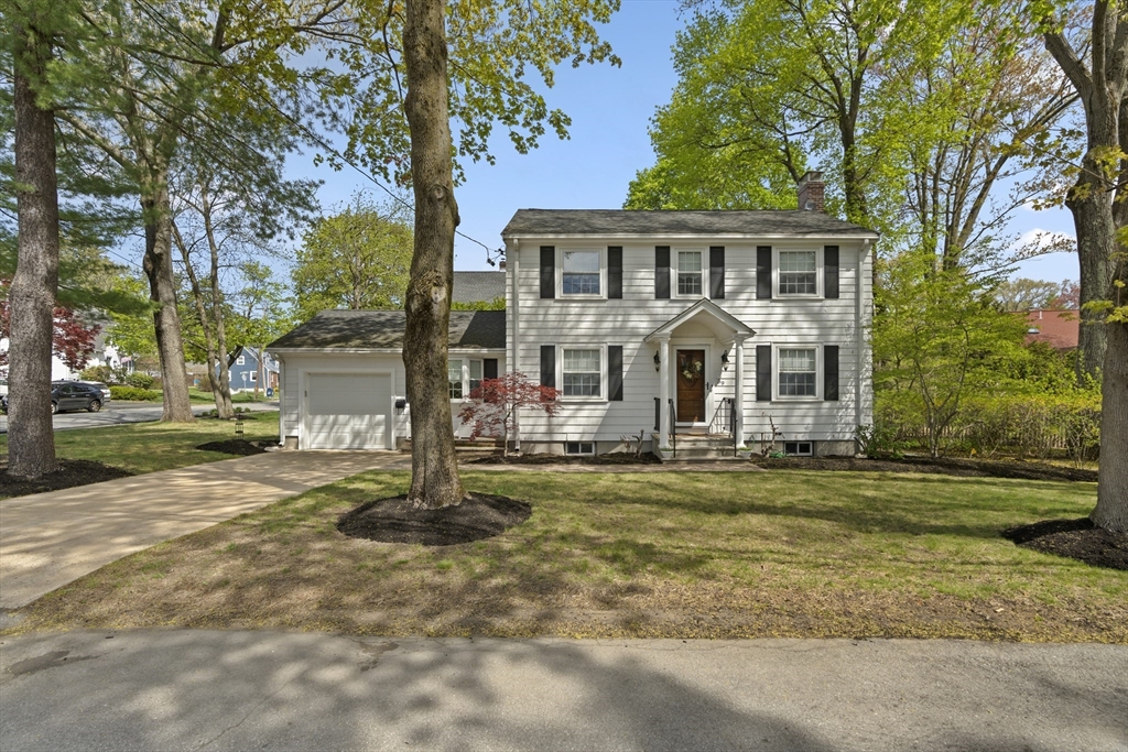 39 Harland Road Waltham, MA 02453 - Photo 1 of 42 a front view of a house with a yard and trees