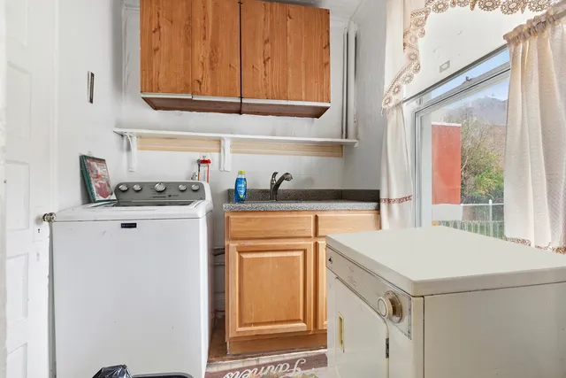 a picture of a bench in front of a wall