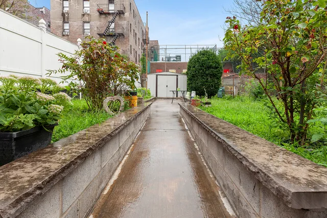 a kitchen with stainless steel appliances a white refrigerator stove and a sink