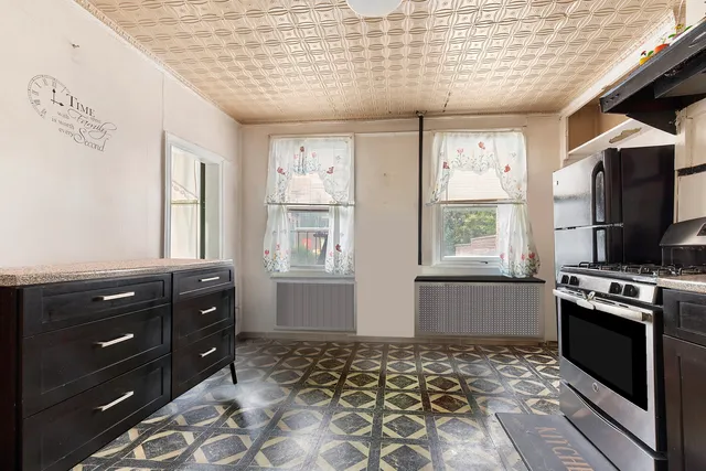 a picture of a bench in front of a wall