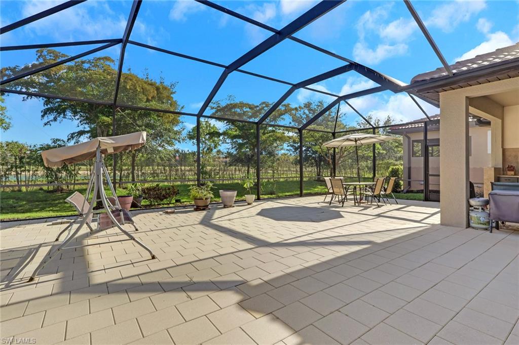 16309 Aberdeen Way Naples, FL 34110 - Photo 31 of 34 a view of outdoor space yard deck patio and swimming pool