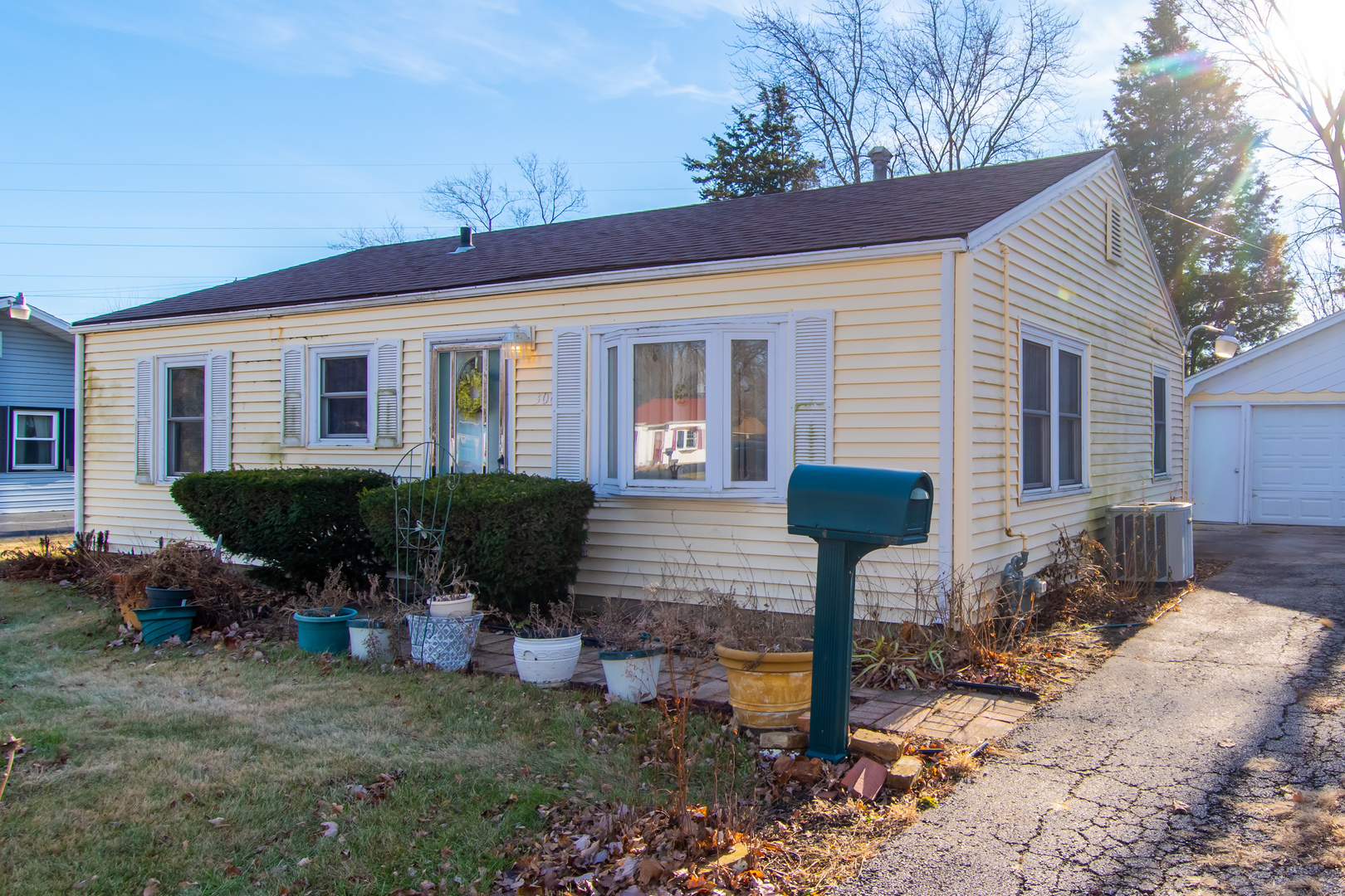 306 Luana Road Joliet, IL 60433 - Photo 2 of 25 a front view of a house with garden