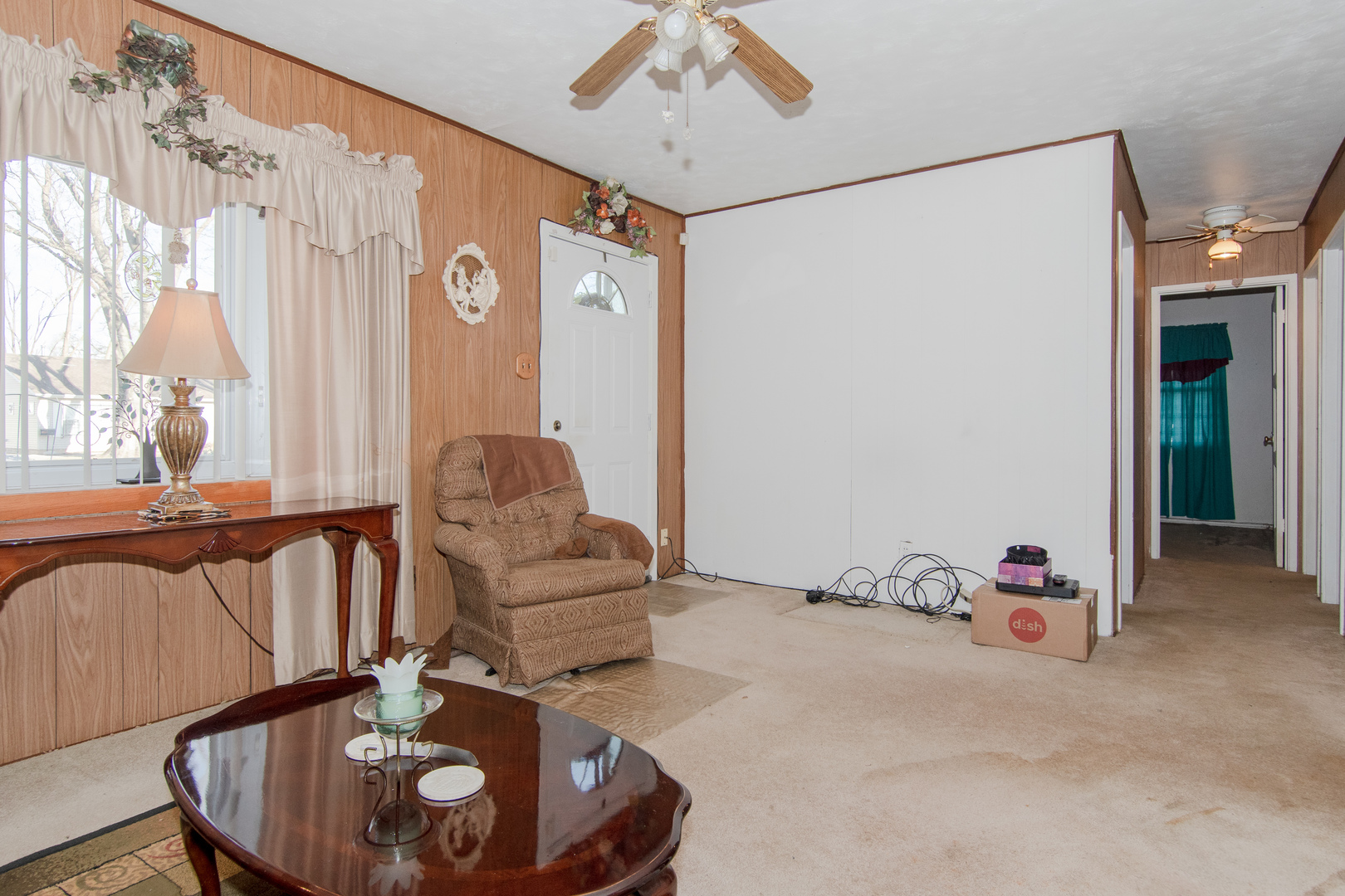 306 Luana Road Joliet, IL 60433 - Photo 12 of 25 a living room with furniture and a large window