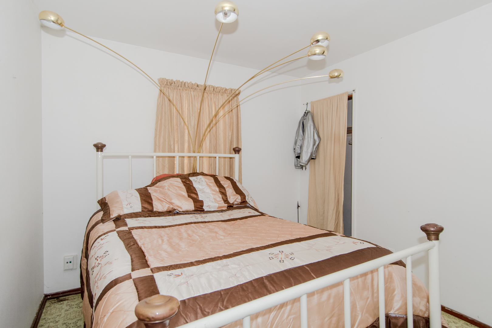 306 Luana Road Joliet, IL 60433 - Photo 18 of 25 a bedroom with a bed and a chandelier