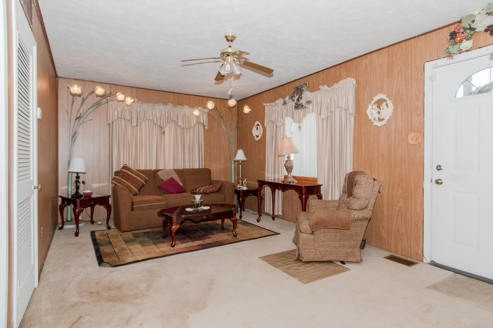 306 Luana Road Joliet, IL 60433 - Photo 9 of 25 a living room with furniture and a large window