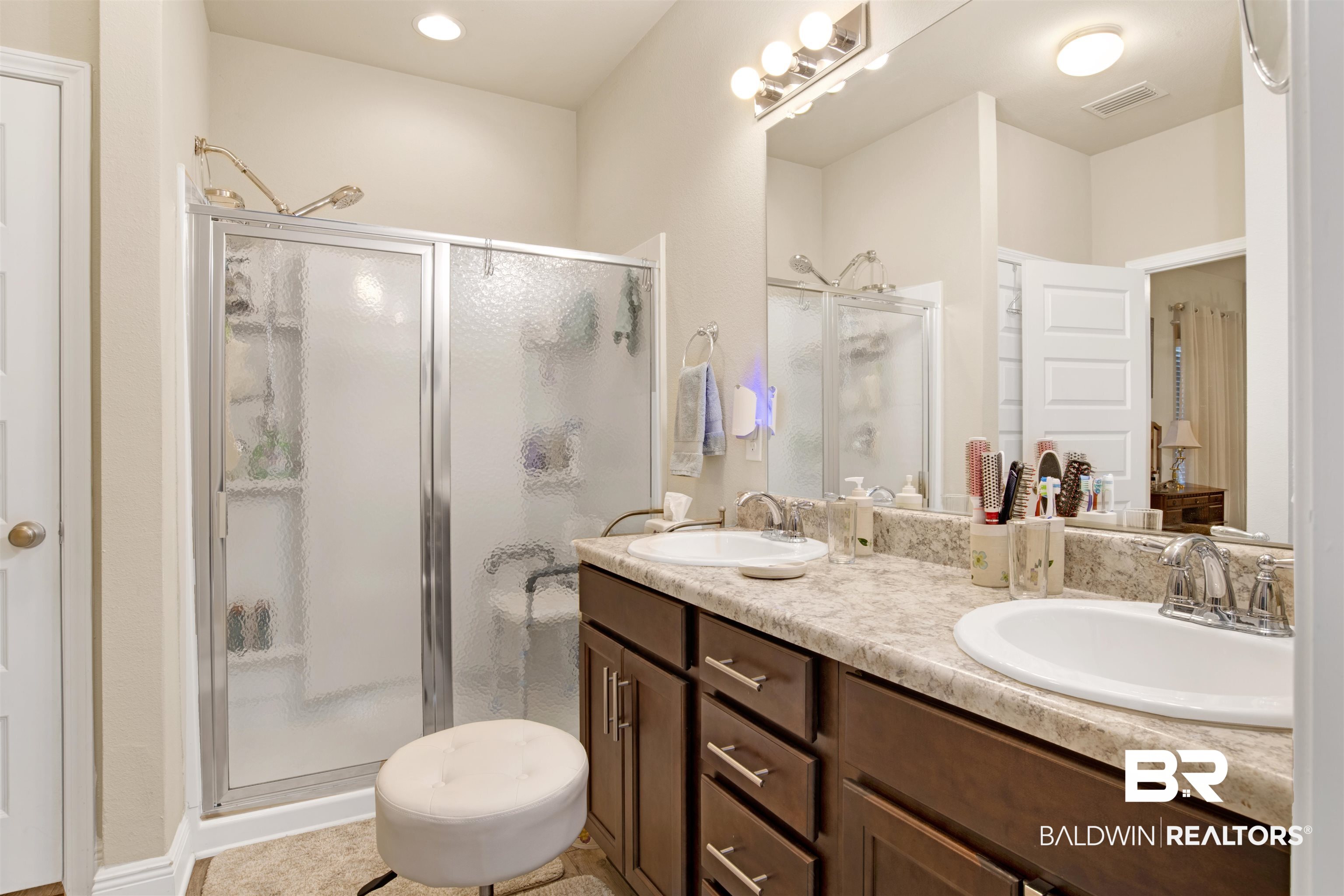 1476 Surrey Loop Foley, AL 36535 - Photo 21 of 31 Bathroom with vanity and a shower with door