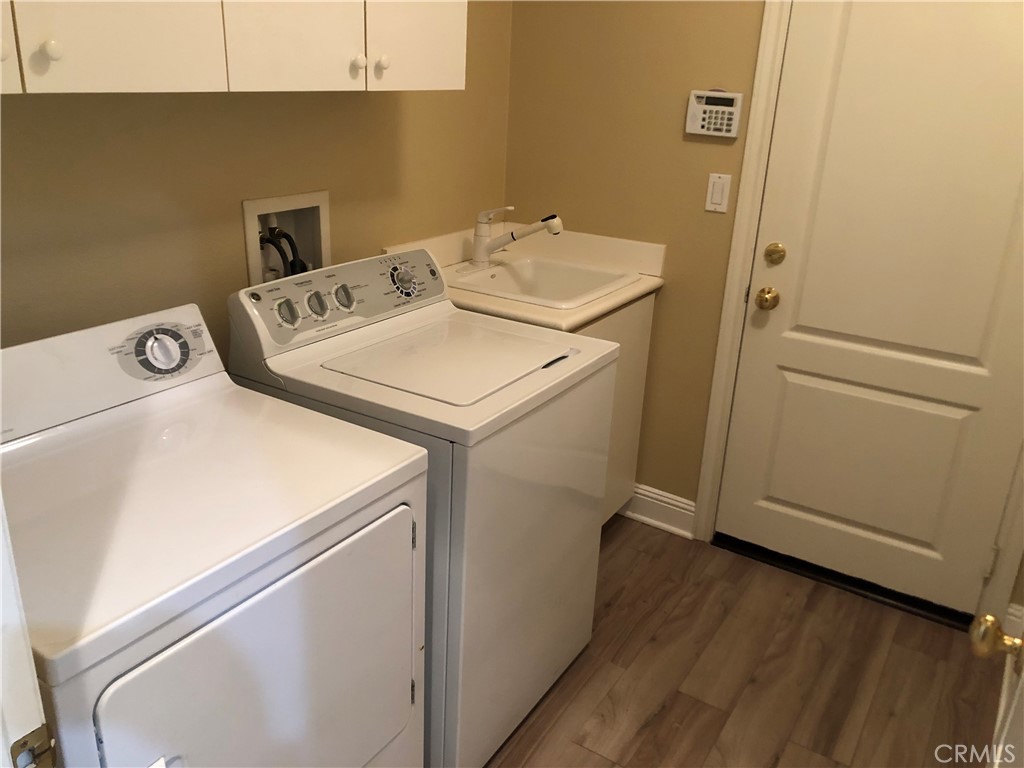 24 Tesoro Newport Coast, CA 92657 - Photo 11 of 19 a utility room with dryer and washer