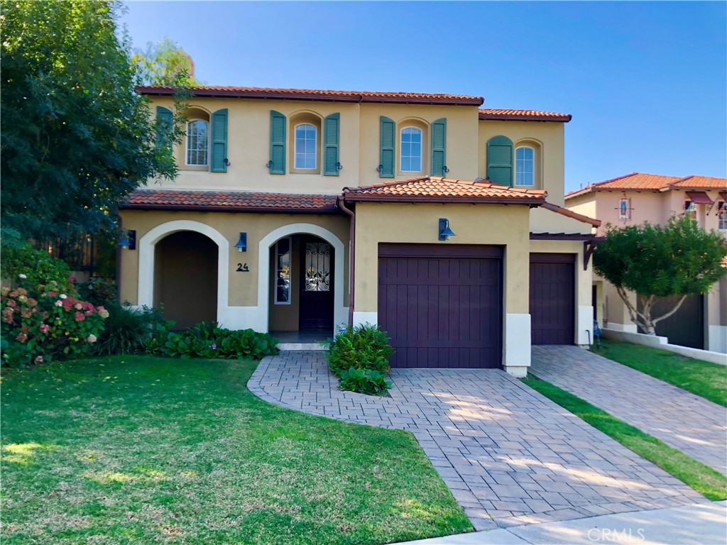 24 Tesoro Newport Coast, CA 92657 - Photo 2 of 19 a front view of a house with a garden
