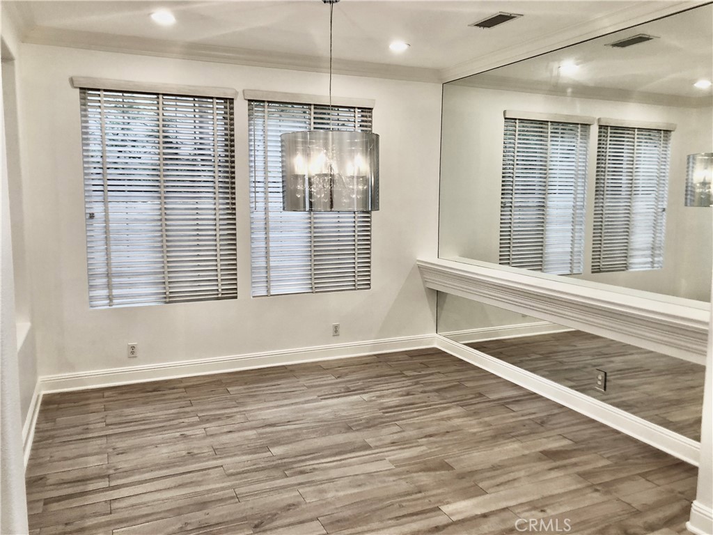 24 Tesoro Newport Coast, CA 92657 - Photo 4 of 19 an empty room with wooden floor and windows