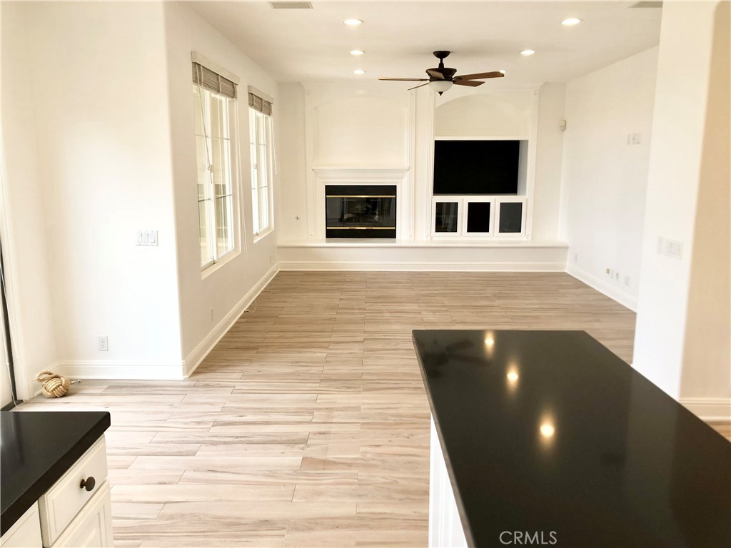 24 Tesoro Newport Coast, CA 92657 - Photo 7 of 19 a view of a living room with furniture and a fireplace