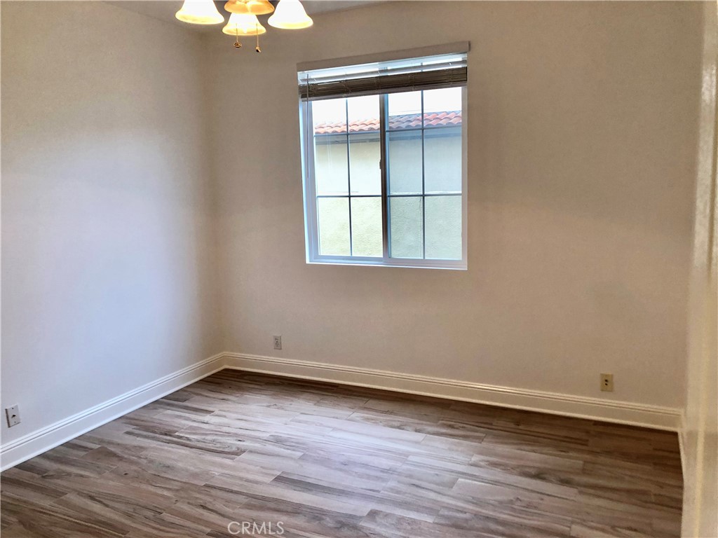 24 Tesoro Newport Coast, CA 92657 - Photo 9 of 19 an empty room with wooden floor and windows