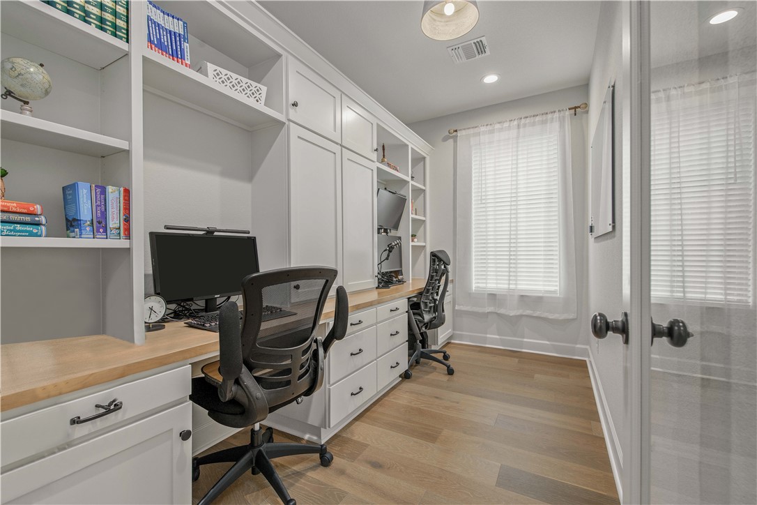 4309 Batona Court Bryan, TX 77802 - Photo 14 of 29 Office area with light wood-style floors, recessed lighting, and built in desk