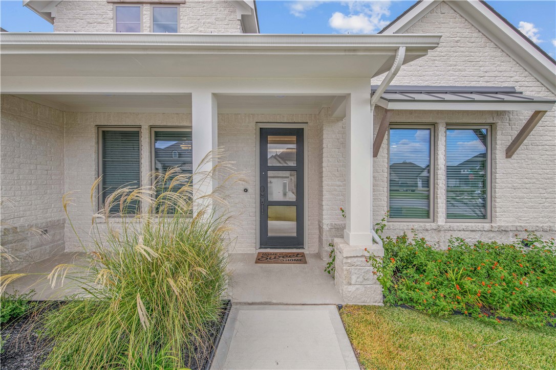 4309 Batona Court Bryan, TX 77802 - Photo 2 of 29 Doorway to property with covered porch and brick siding