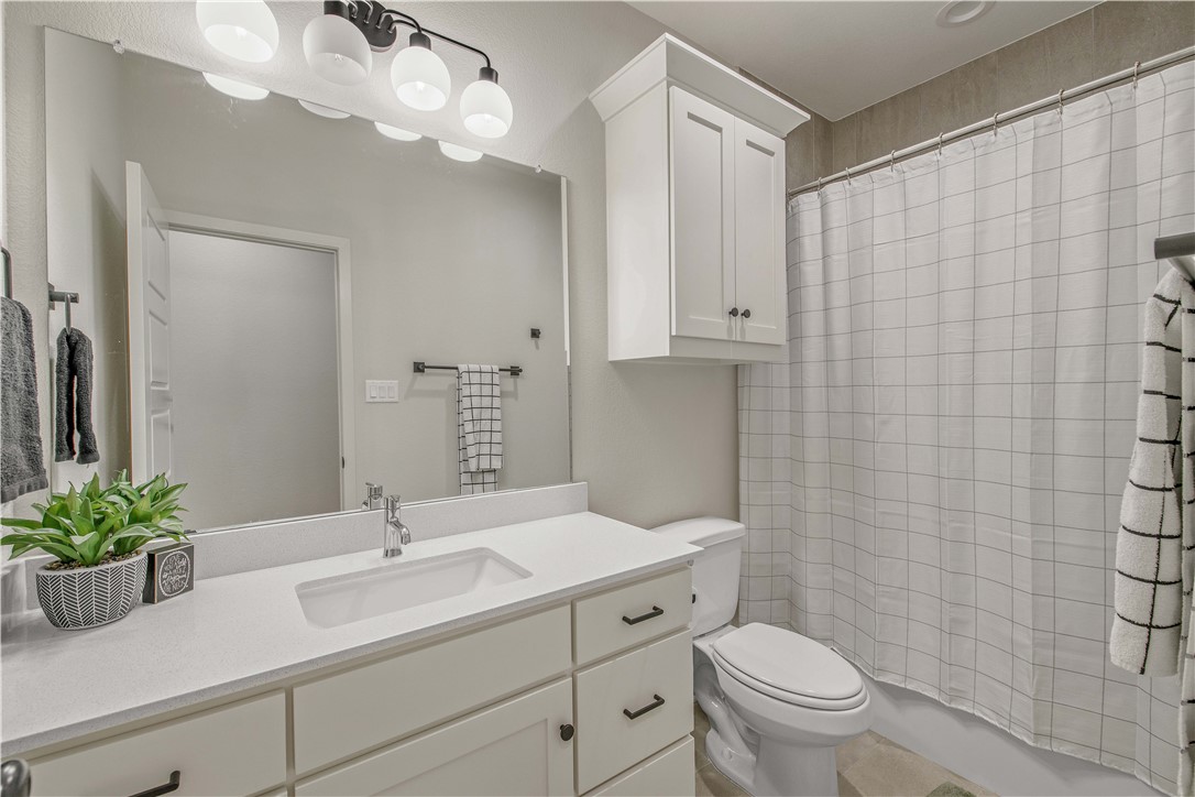 4309 Batona Court Bryan, TX 77802 - Photo 23 of 29 Bathroom featuring vanity and toilet
