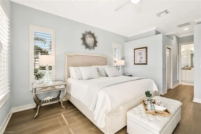 a bedroom with a bed and a table