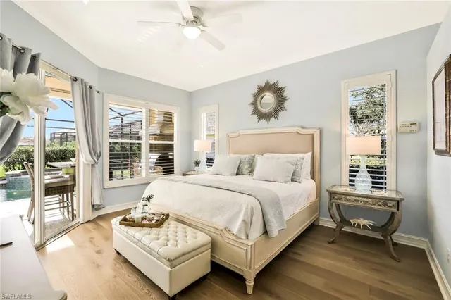 a spacious bedroom with a bed and a large window