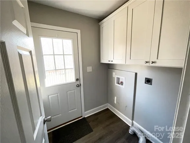 a view of an empty room and wooden floor