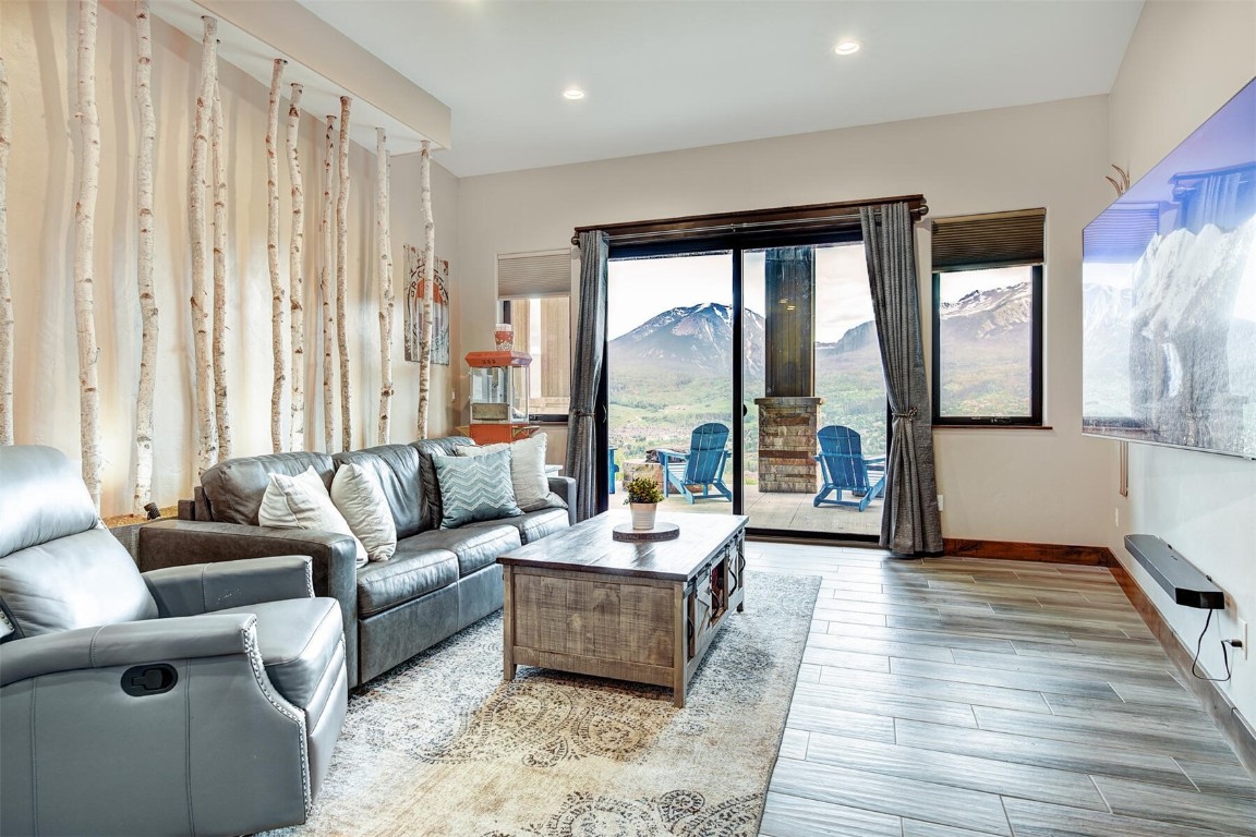 363 Angler Mountain Ranch Road Silverthorne, CO 80498 - Photo 22 of 44 Lower level family room provides access to the outdoor patio that features gas firepits and a hot tub