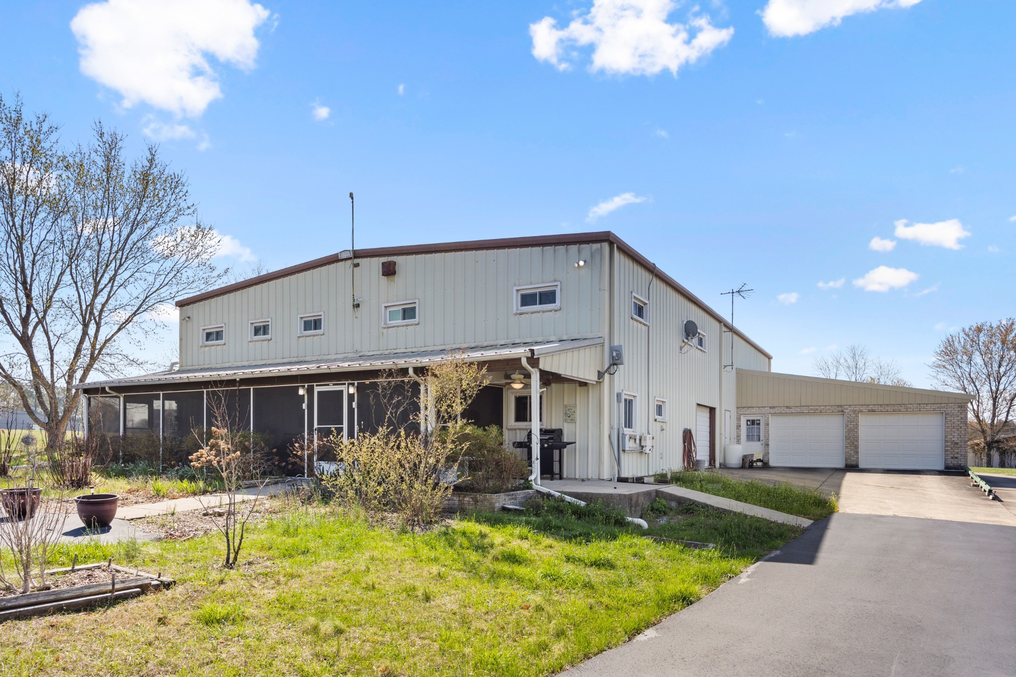 a view of a house with swimming pool and a chairs in a patio