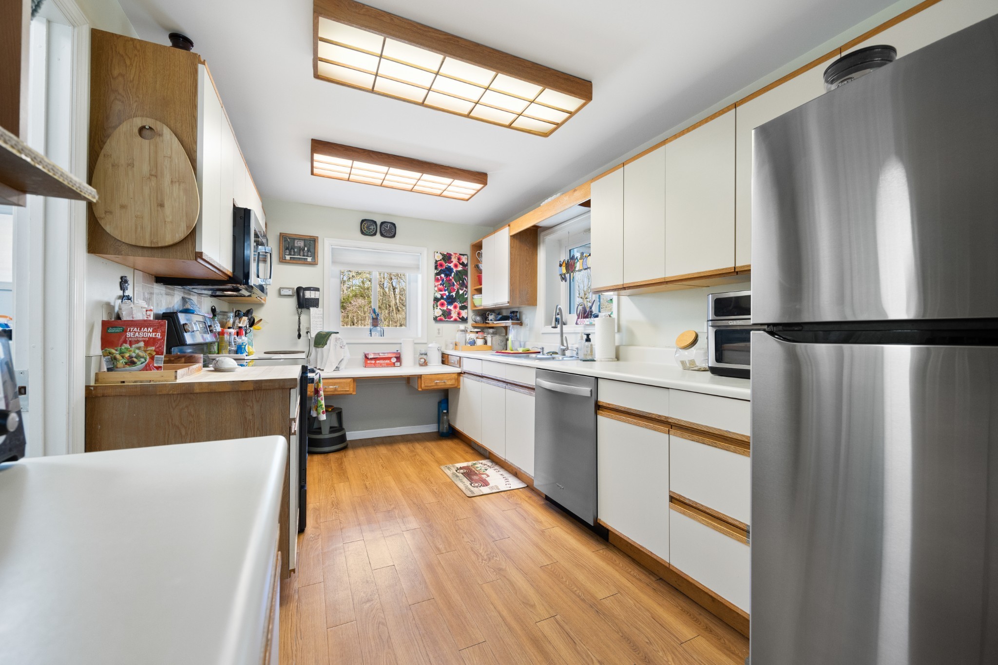 205 Gwynn Road, Unit HANGAR #8 Lebanon, TN 37090 - Photo 14 of 35 a kitchen with stainless steel appliances granite countertop a refrigerator a sink dishwasher a stove with wooden cabinets and floor