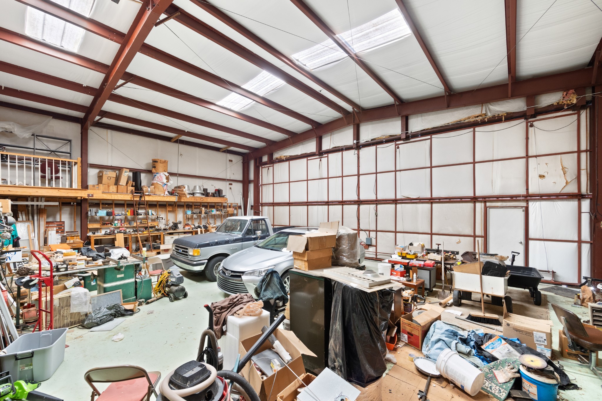 205 Gwynn Road, Unit HANGAR #8 Lebanon, TN 37090 - Photo 17 of 35 a city room with lots of furniture and clutter