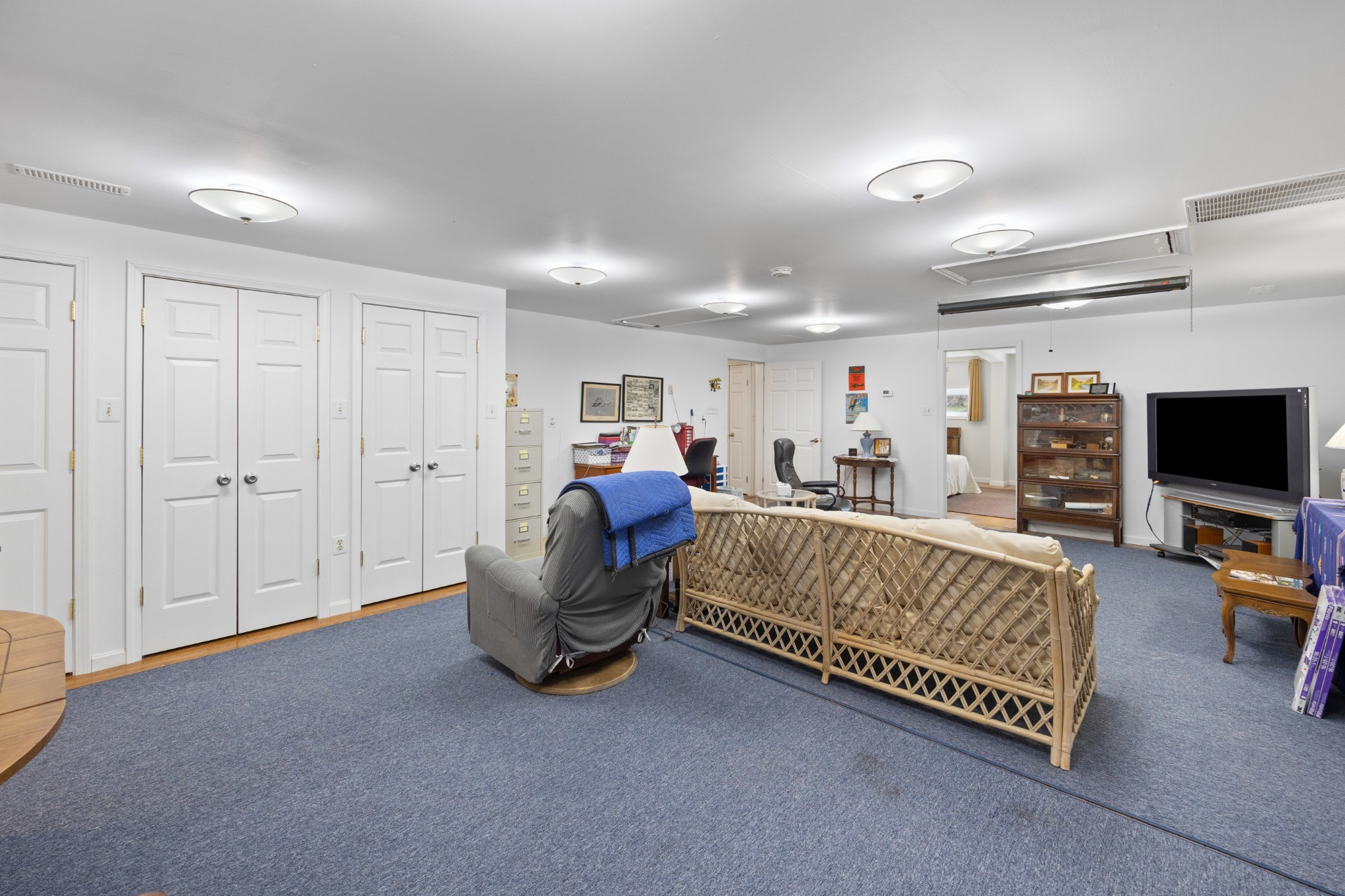 205 Gwynn Road, Unit HANGAR #8 Lebanon, TN 37090 - Photo 20 of 35 a bed room with furniture and a flat screen tv